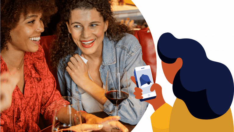 Women at a table and a graphic of a woman with phone